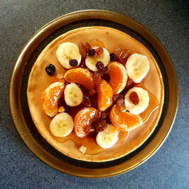 Sweet pancake with fresh fruits, jam and honey
